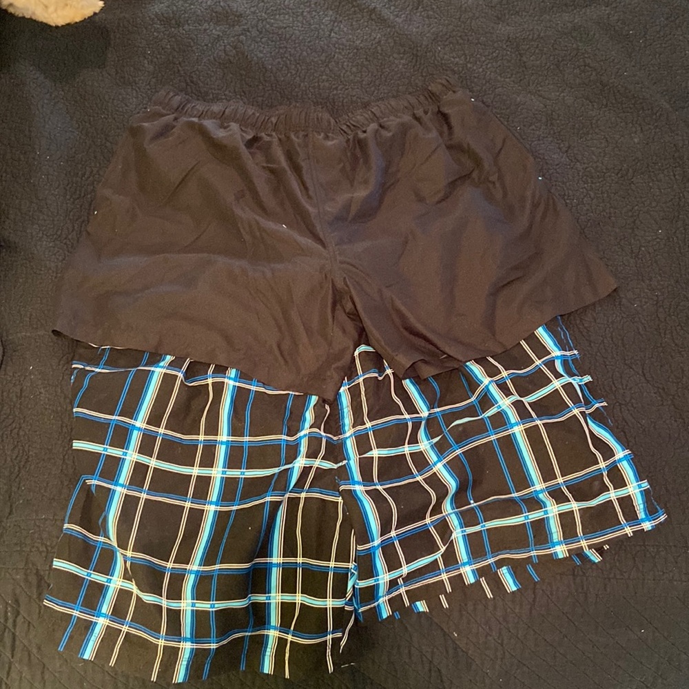 Two mens xxl bathing suits solid black and plaid